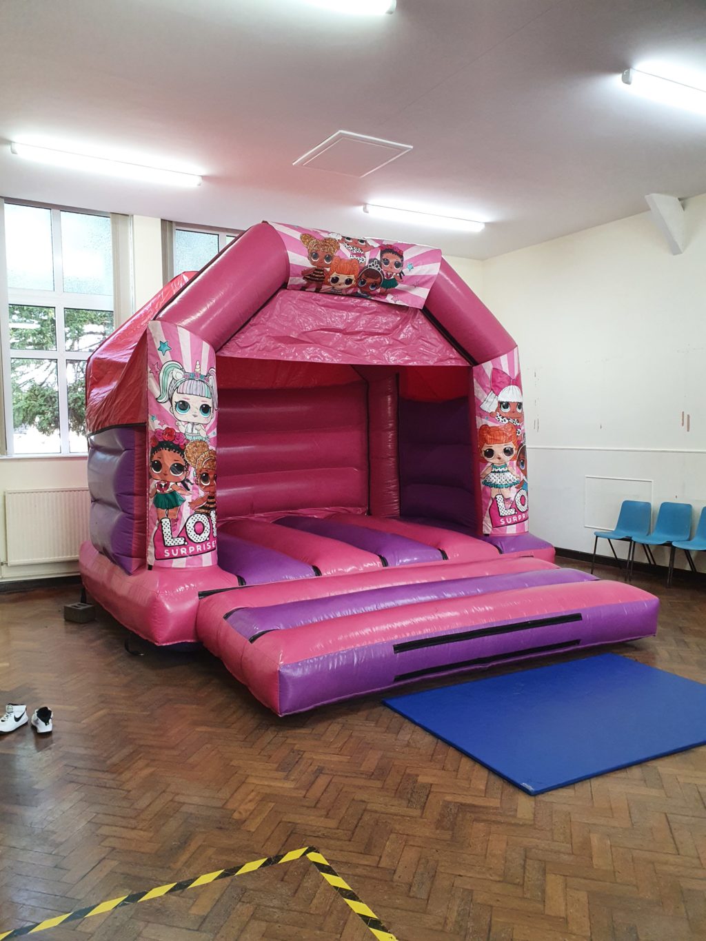 A pink bouncy castle in the village hall